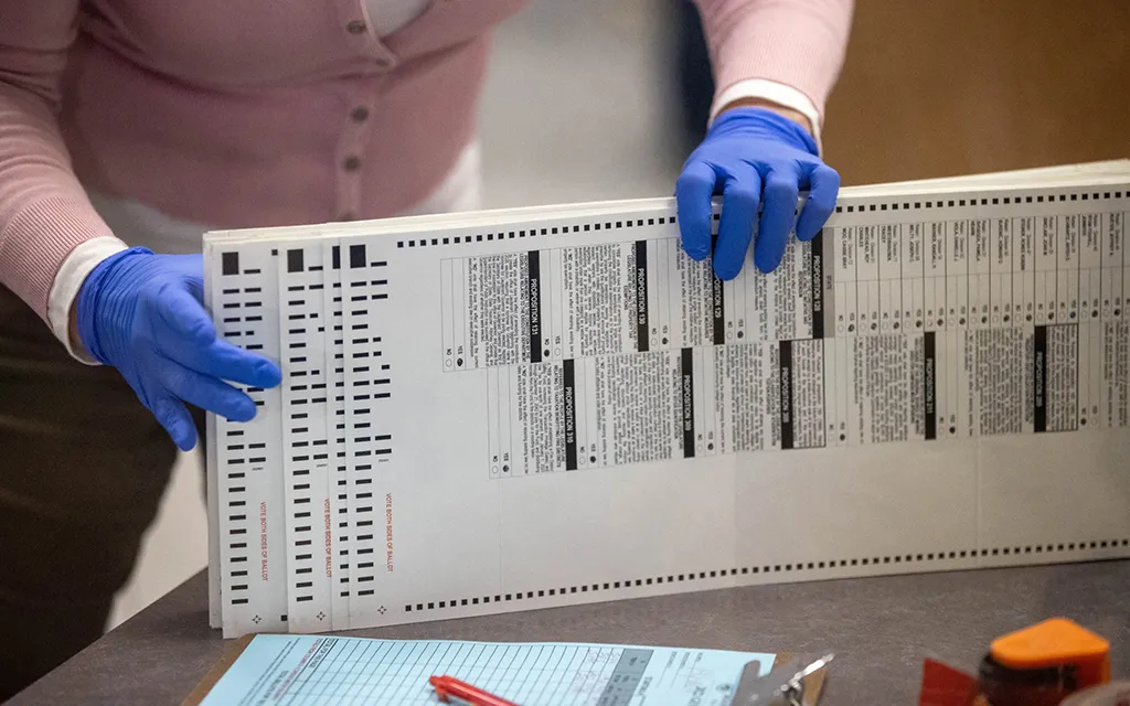A worker at Maricopa County process ballots for tabulation.